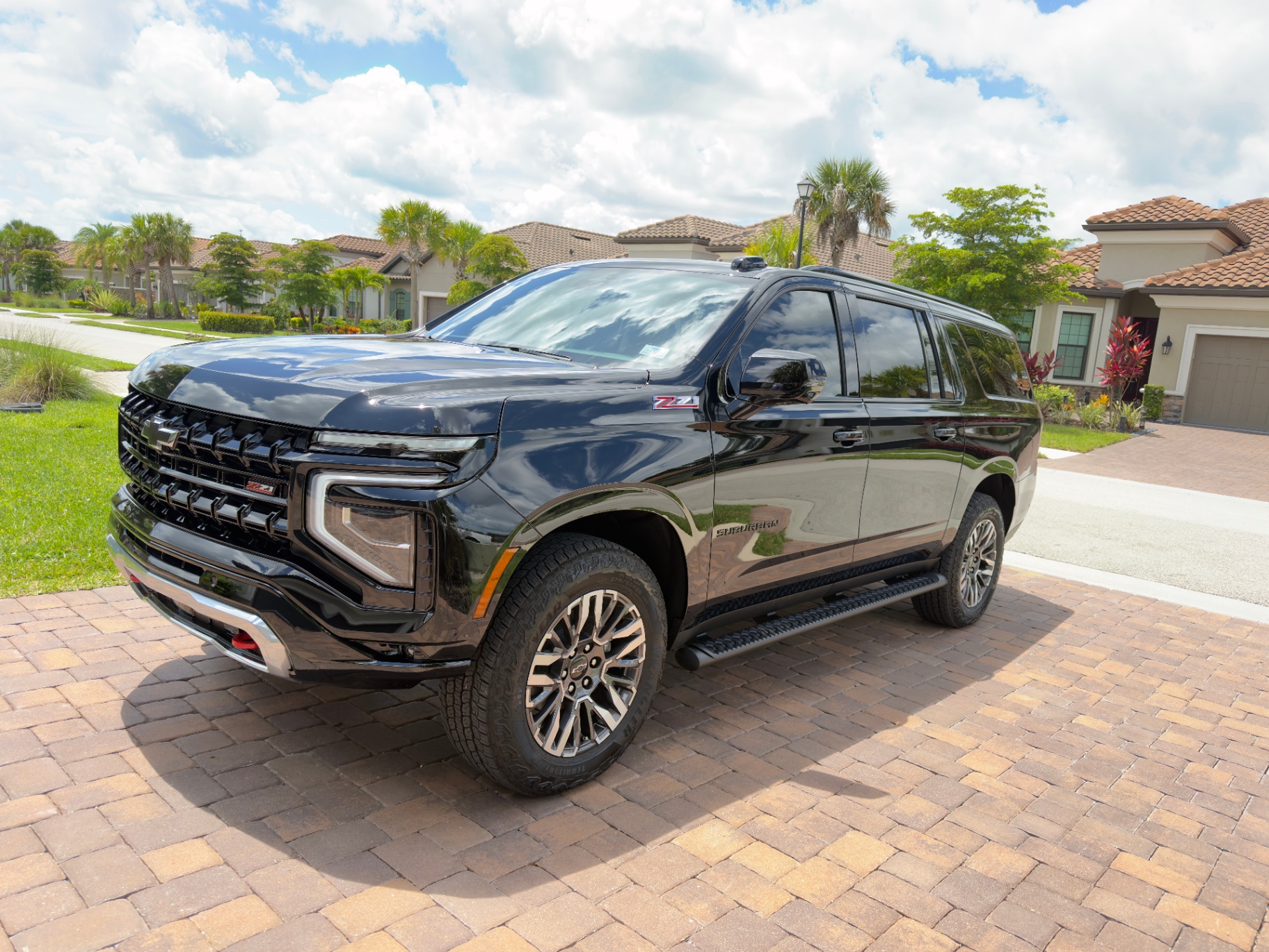 Black 2025 Chevrolet Suburban Z71 — your assigned fleet vehicle